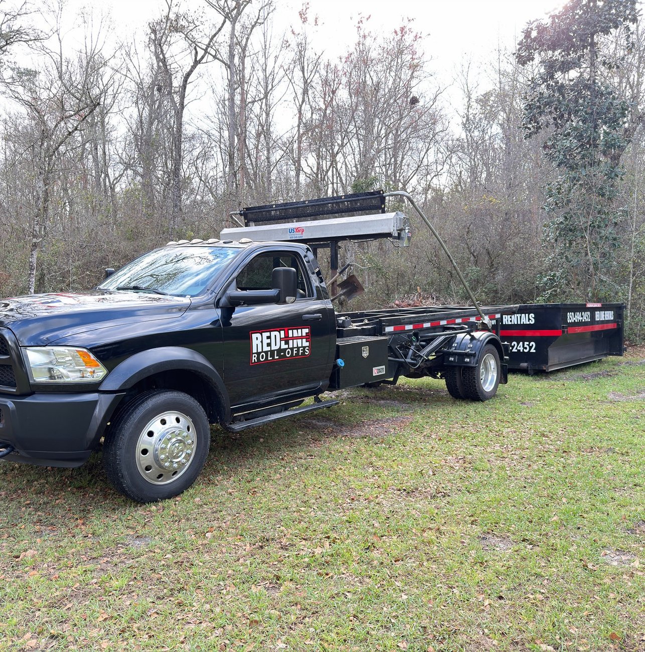 Red Line Rentals roll-off dumpster delivered to a home in Tallahassee, FL