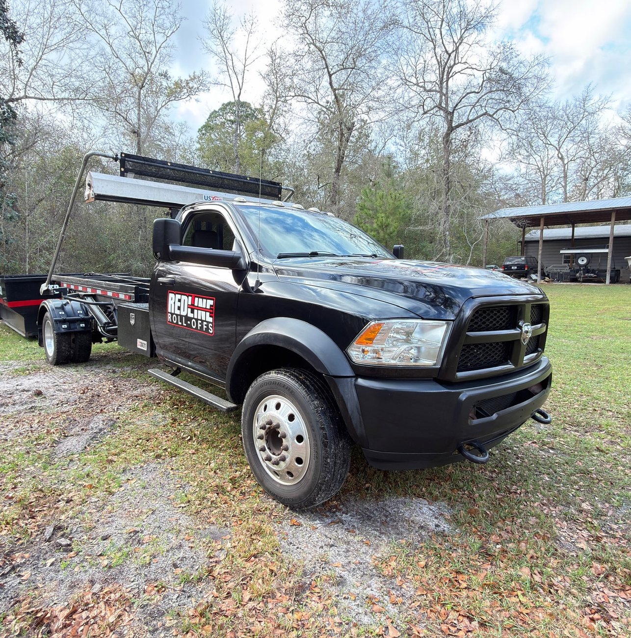 Red Line Rentals roll-off dumpster delivered to a home in Fort Braden, FL