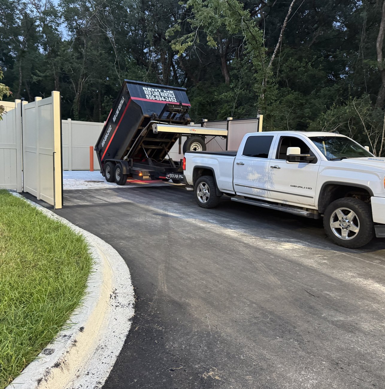 Red Line Rentals roll-off dumpster at a residential cleanout in Tallahassee, FL