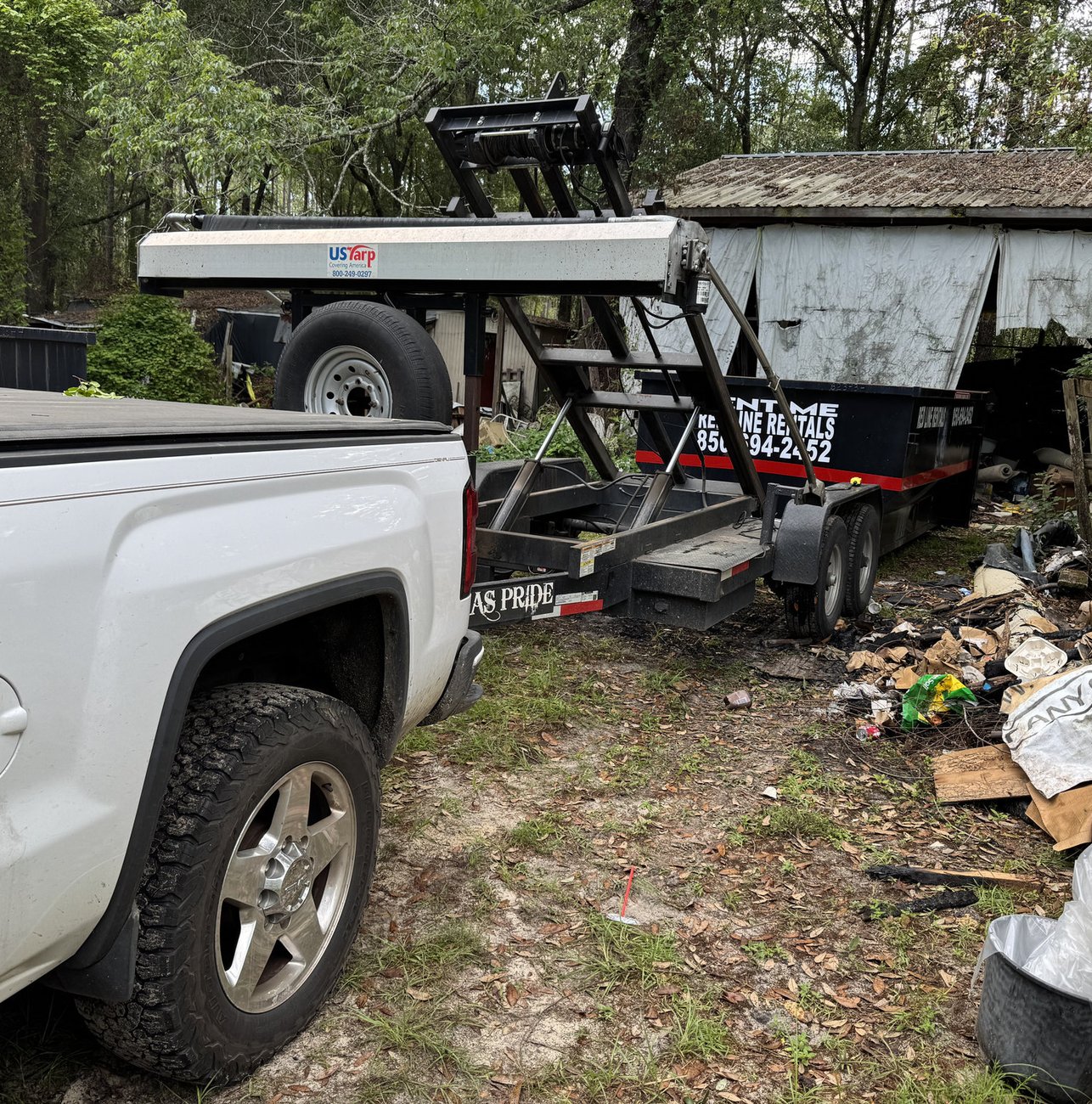 Red Line Rentals roll-off dumpster ready for pickup in Tallahassee, FL