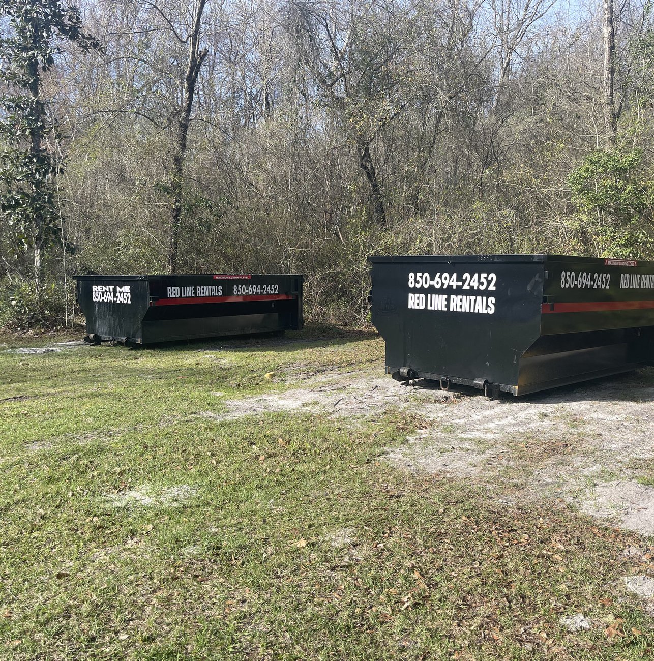 Red Line Rentals roll-off dumpster at a residential cleanout in Smith Creek, FL