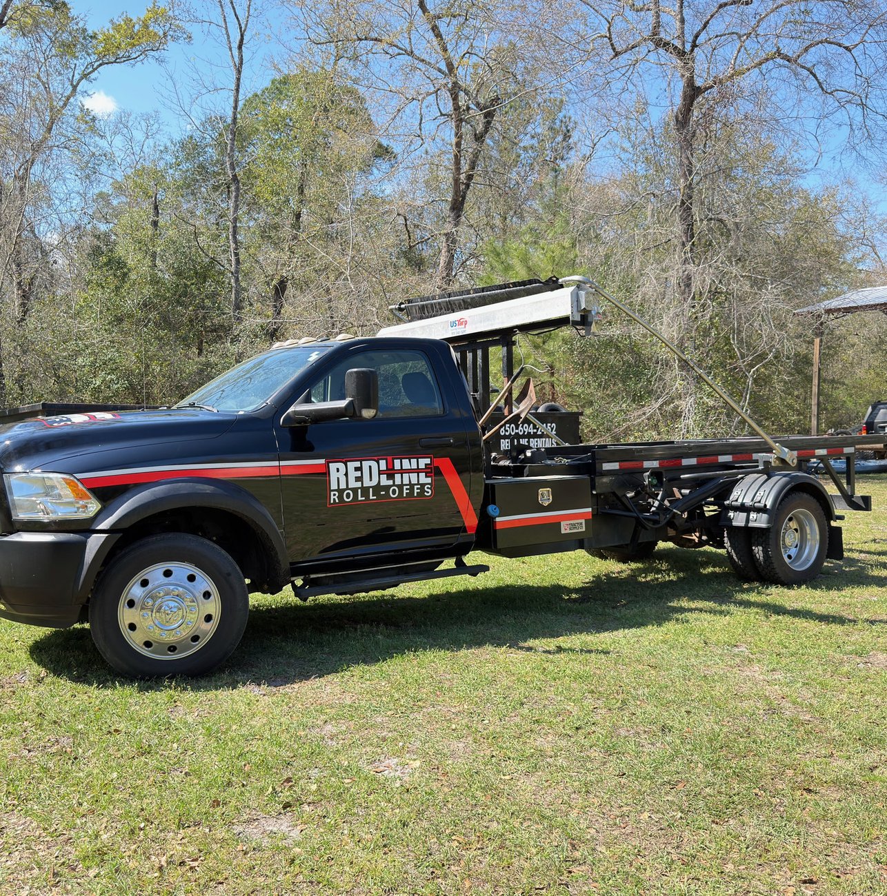 Red Line Rentals roll-off dumpster delivered to a home in Lanark Village, FL