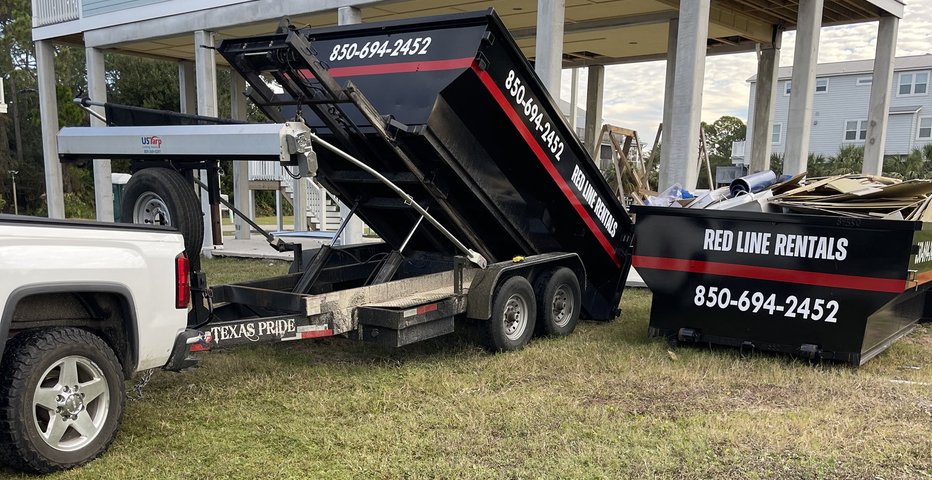 Red Line Rentals dump trailer and roll-off dumpster during a cleanout at a raised coastal home