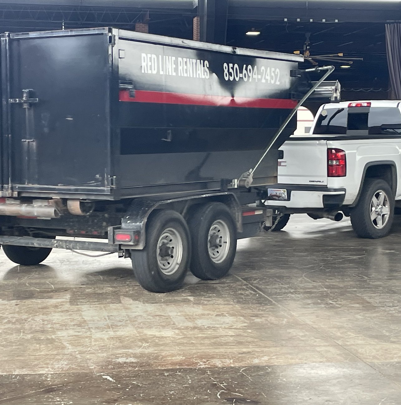 Red Line Rentals roll-off dumpster at a commercial job site in Medart, FL
