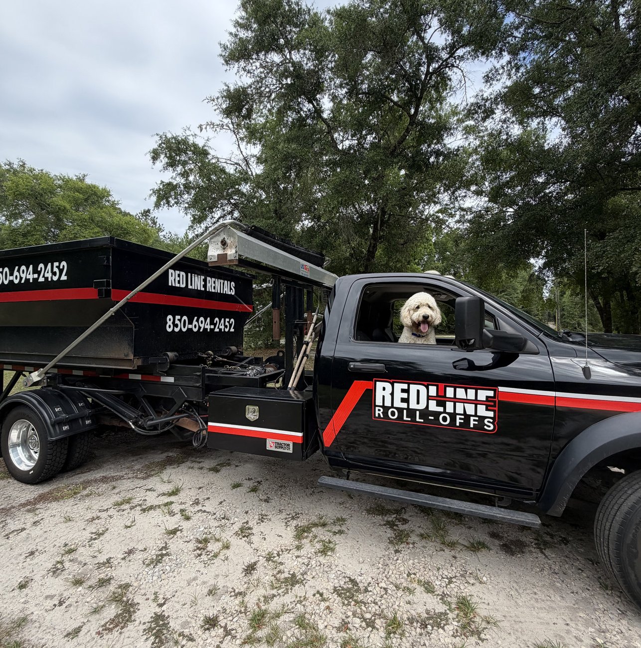 Red Line Rentals roll-off dumpster on a Leon County, FL job site